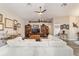 Living room with hardwood floors, large sectional sofa, and built-in shelving at 4933 Sw 109Th Loop, Ocala, FL 34476