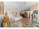 Living room with hardwood floors, sectional sofa, and built-in shelving at 4933 Sw 109Th Loop, Ocala, FL 34476