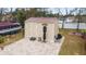 Beige storage shed with paver patio in backyard at 4933 Sw 109Th Loop, Ocala, FL 34476