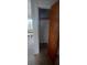 Empty closet with wood door and shelving at 5235 Se 107Th St, Belleview, FL 34420