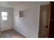 Small room with wall shelving and new flooring at 5235 Se 107Th St, Belleview, FL 34420