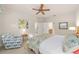 Spacious bedroom with a queen bed and ensuite bathroom access at 6751 Sw 91St Cir, Ocala, FL 34481