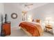 Main bedroom with ceiling fan and large bed at 6751 Sw 91St Cir, Ocala, FL 34481