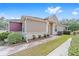 Tan and burgundy house with patterned walkway at 6751 Sw 91St Cir, Ocala, FL 34481