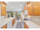 Well-equipped kitchen featuring wood cabinets and granite countertops at 6751 Sw 91St Cir, Ocala, FL 34481