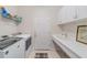 Laundry room with washer, dryer, and sink at 6751 Sw 91St Cir, Ocala, FL 34481