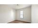 Well-lit bedroom with wood-look floors and a large window at 7000 Sw 129Th Pl, Ocala, FL 34473