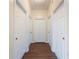 Hallway with multiple doors leading to bedrooms and other rooms at 7000 Sw 129Th Pl, Ocala, FL 34473