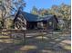 Rustic single story home with wood siding and ramp access at 9100 Se 180Th Avenue Rd, Ocklawaha, FL 32179