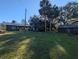 Property view showcasing multiple buildings and open space at 9100 Se 180Th Avenue Rd, Ocklawaha, FL 32179