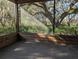 Sunroom with tiled floor and stunning views of the surrounding nature at 9100 Se 180Th Avenue Rd, Ocklawaha, FL 32179