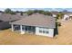 Aerial view of backyard and screened-in lanai offering ample outdoor living space at 9836 Sw 75Th Street Rd, Ocala, FL 34481