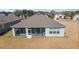 Aerial view of home with screened-in lanai, a perfect space for relaxing and entertaining at 9836 Sw 75Th Street Rd, Ocala, FL 34481