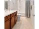 Bathroom with a shower/tub combo and a wood vanity at 9836 Sw 75Th Street Rd, Ocala, FL 34481