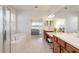 Bathroom featuring a soaking tub, double vanity, tiled floors, and a view to bedroom and lake at 9836 Sw 75Th Street Rd, Ocala, FL 34481