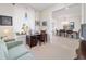 Home office with a view into the dining room, featuring large windows with curtains at 9836 Sw 75Th Street Rd, Ocala, FL 34481