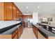 Modern kitchen featuring stainless steel appliances, granite countertops, and ample cabinet space at 9836 Sw 75Th Street Rd, Ocala, FL 34481