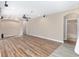 Large living room with hardwood floors and adjacent bathroom at 10384 Sw 41St Ave, Ocala, FL 34476