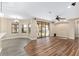 Living room with hardwood floors, pool view, and ceiling fan at 10384 Sw 41St Ave, Ocala, FL 34476