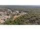 Aerial view of a residential neighborhood nestled in a wooded area at 11642 Sw 71St Cir, Ocala, FL 34476