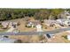 Aerial view of house and surrounding neighborhood, showcasing the community landscape at 11642 Sw 71St Cir, Ocala, FL 34476