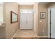 Interior entryway with tile floor and double doors at 11642 Sw 71St Cir, Ocala, FL 34476