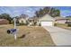 Front view of house with landscaping, driveway and mailbox at 11642 Sw 71St Cir, Ocala, FL 34476