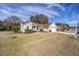 Front view of house showcasing landscaping and driveway at 11642 Sw 71St Cir, Ocala, FL 34476