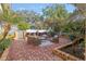 Relaxing patio with brick pavers, wicker furniture, and lush landscaping at 1244 Se 11Th St, Ocala, FL 34471