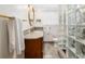 Modern bathroom with granite countertops and glass block shower at 1244 Se 11Th St, Ocala, FL 34471