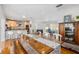 Bright dining area with farmhouse table and view of the kitchen at 1244 Se 11Th St, Ocala, FL 34471