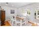 Elegant dining room with hardwood floors and view to the sunroom at 1244 Se 11Th St, Ocala, FL 34471