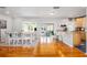 Light-filled dining area with hardwood floors and farmhouse table at 1244 Se 11Th St, Ocala, FL 34471