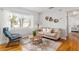 Cozy living room featuring hardwood floors and a view to the bedroom at 1244 Se 11Th St, Ocala, FL 34471