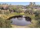 Serene pond with fountain, ducks, and lush greenery at 1244 Se 11Th St, Ocala, FL 34471