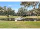 Picturesque pond view, featuring fountain and surrounding trees at 1244 Se 11Th St, Ocala, FL 34471