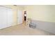 Spacious bedroom with double closet and view of living area at 13775 Sw 115Th Pl, Dunnellon, FL 34432