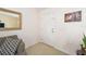 Bright and airy entryway with a white door and gold mirror at 13775 Sw 115Th Pl, Dunnellon, FL 34432