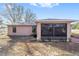 Well maintained house exterior with a screened sunroom at 13775 Sw 115Th Pl, Dunnellon, FL 34432