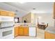 Modern kitchen with white appliances and ample counter space at 13775 Sw 115Th Pl, Dunnellon, FL 34432