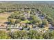 Aerial view of neighborhood with lush green trees at 14146 Sw 112Th Cir, Dunnellon, FL 34432