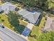 Overhead view of a house with a gray roof, surrounded by trees at 14146 Sw 112Th Cir, Dunnellon, FL 34432