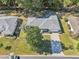 Bird's eye view of a house, showcasing its layout and surrounding landscape at 14146 Sw 112Th Cir, Dunnellon, FL 34432