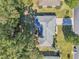 Top-down view of a single-story house with a gray roof and a driveway at 14146 Sw 112Th Cir, Dunnellon, FL 34432