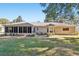 House exterior showcasing backyard and screened porch at 14146 Sw 112Th Cir, Dunnellon, FL 34432