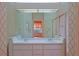 Bathroom with double vanity and a shower/tub combo at 19247 Sw 98Th Loop, Dunnellon, FL 34432