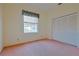 Well-lit bedroom with a large closet and window at 19247 Sw 98Th Loop, Dunnellon, FL 34432