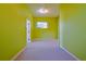 Simple bedroom with green walls and a window offering natural light at 19247 Sw 98Th Loop, Dunnellon, FL 34432