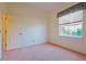 Bright bedroom with ample natural light and neutral carpeting at 19247 Sw 98Th Loop, Dunnellon, FL 34432