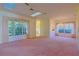 Bright living room with large windows and vaulted ceiling at 19247 Sw 98Th Loop, Dunnellon, FL 34432